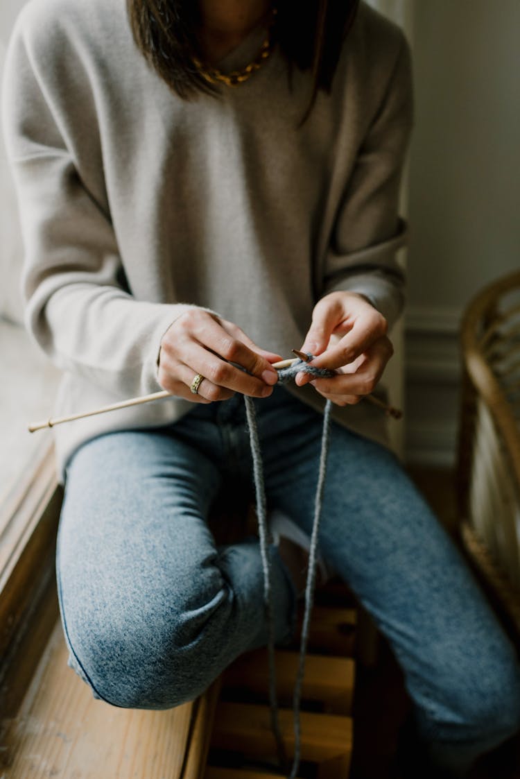 Close-up View Of Knitting Woman