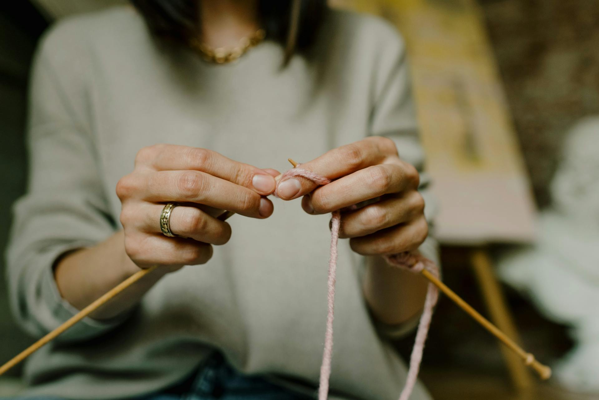 A Person Knitting 