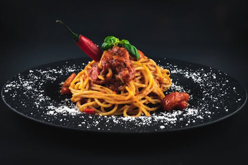 Free Spaghetti on Black Ceramic Plate Stock Photo