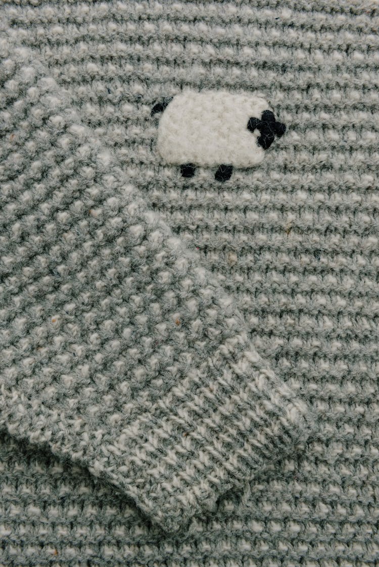 Close-up Of A Sweater With A Sheep 