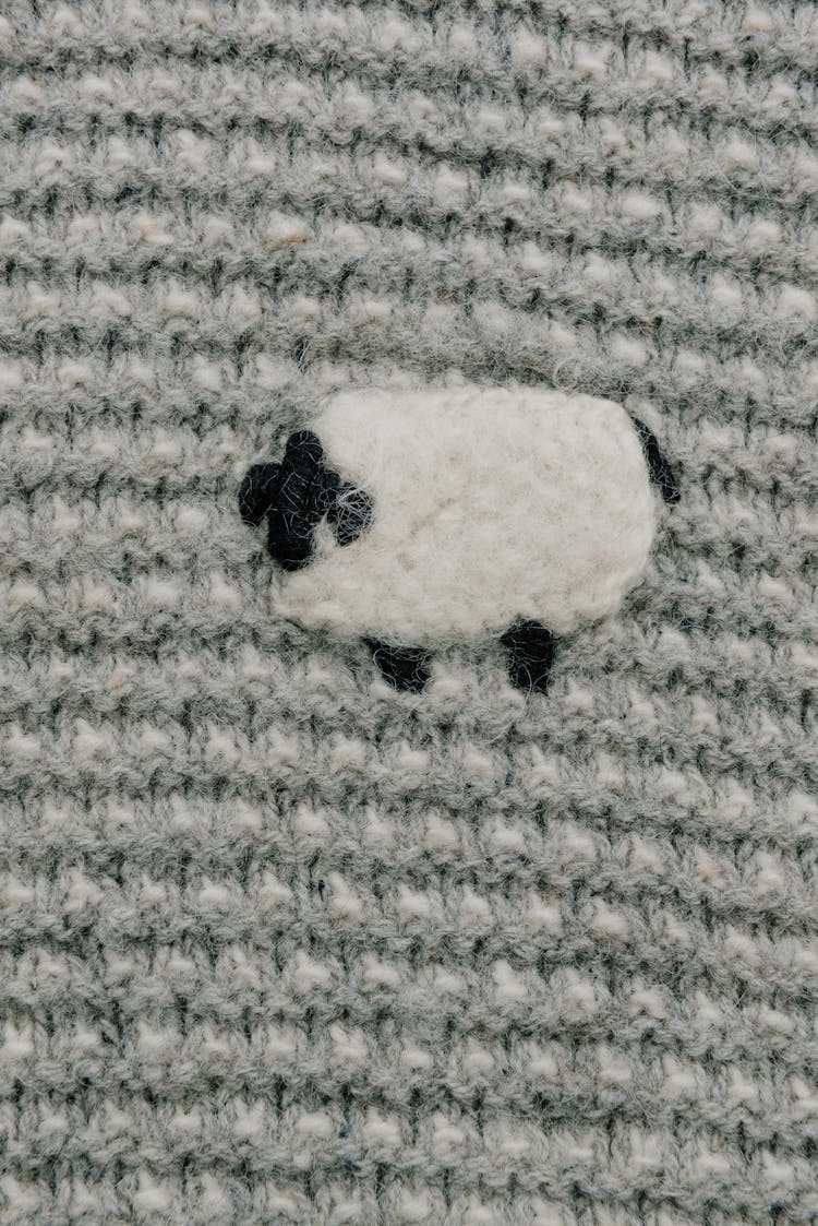 Knitted Sheep On A Sweater