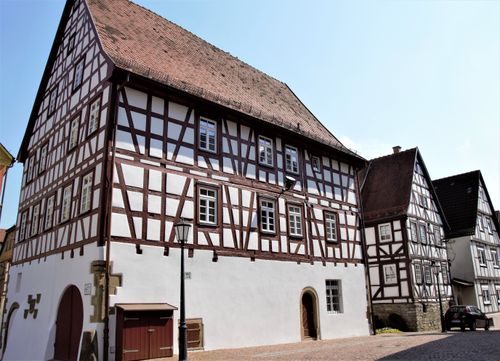 Free Idyllic street view of traditional half-timbered houses in a quaint European village, showcasing classic architecture. Stock Photo