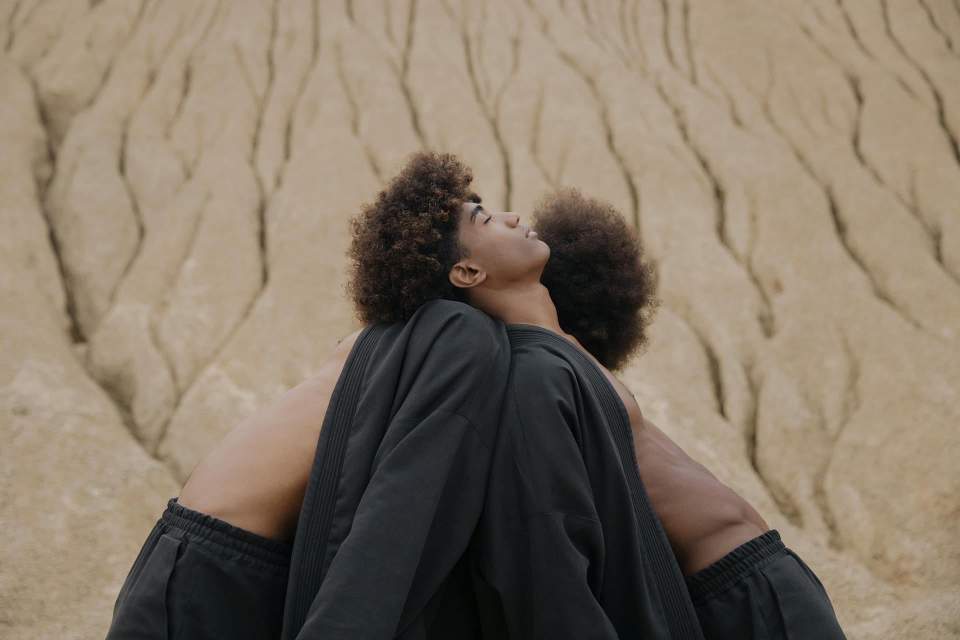 Men leaning their Heads on one another