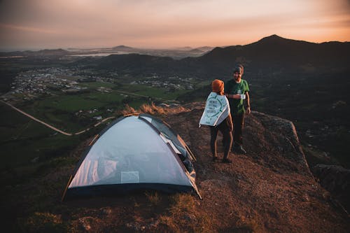 Free Couple standing near Tent  Stock Photo