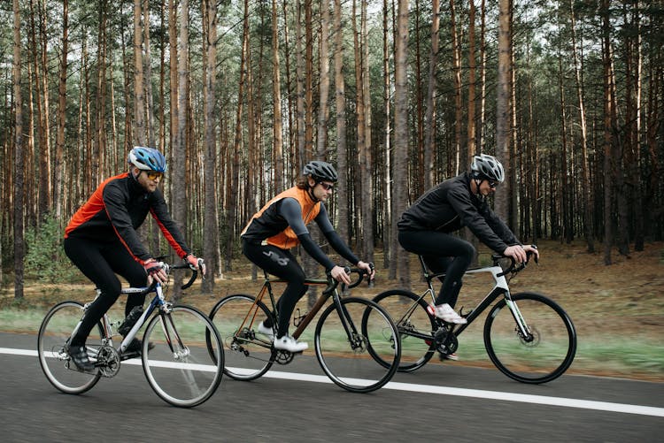 Men Riding Bicycles On The Road