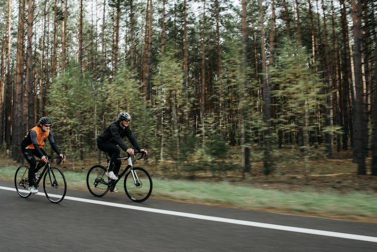 Men Riding Bicycles On The Road