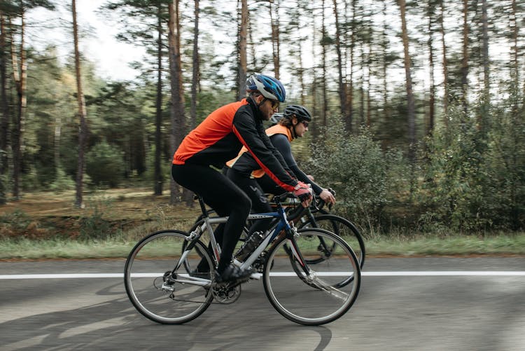 Men Riding Bicycles On The Road