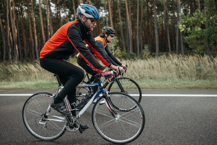 Men Riding Bicycles On The Road