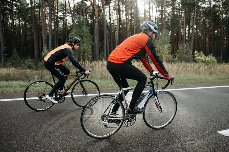 Men Riding Bicycles On The Road