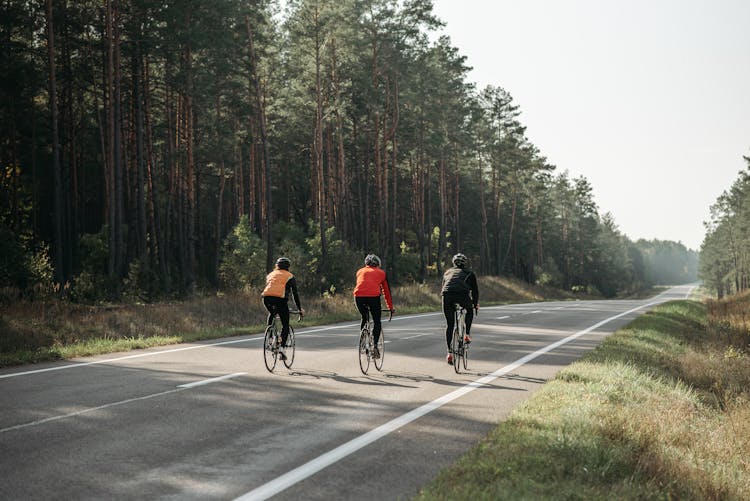 Men Riding Bicycles On The Road