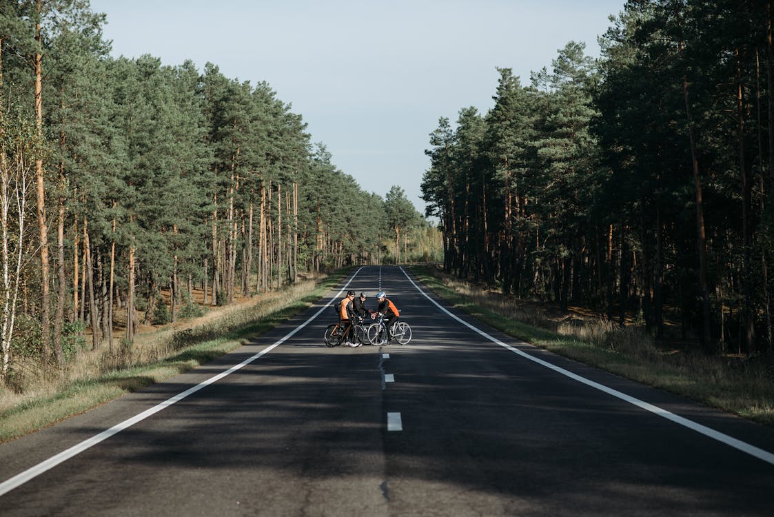 Bikers resting in the Middle of the Road 