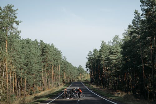 Free Bikers riding in the Middle of the Road  Stock Photo