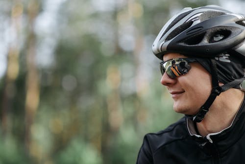 Close-up Photo of Biker with Helmet On 