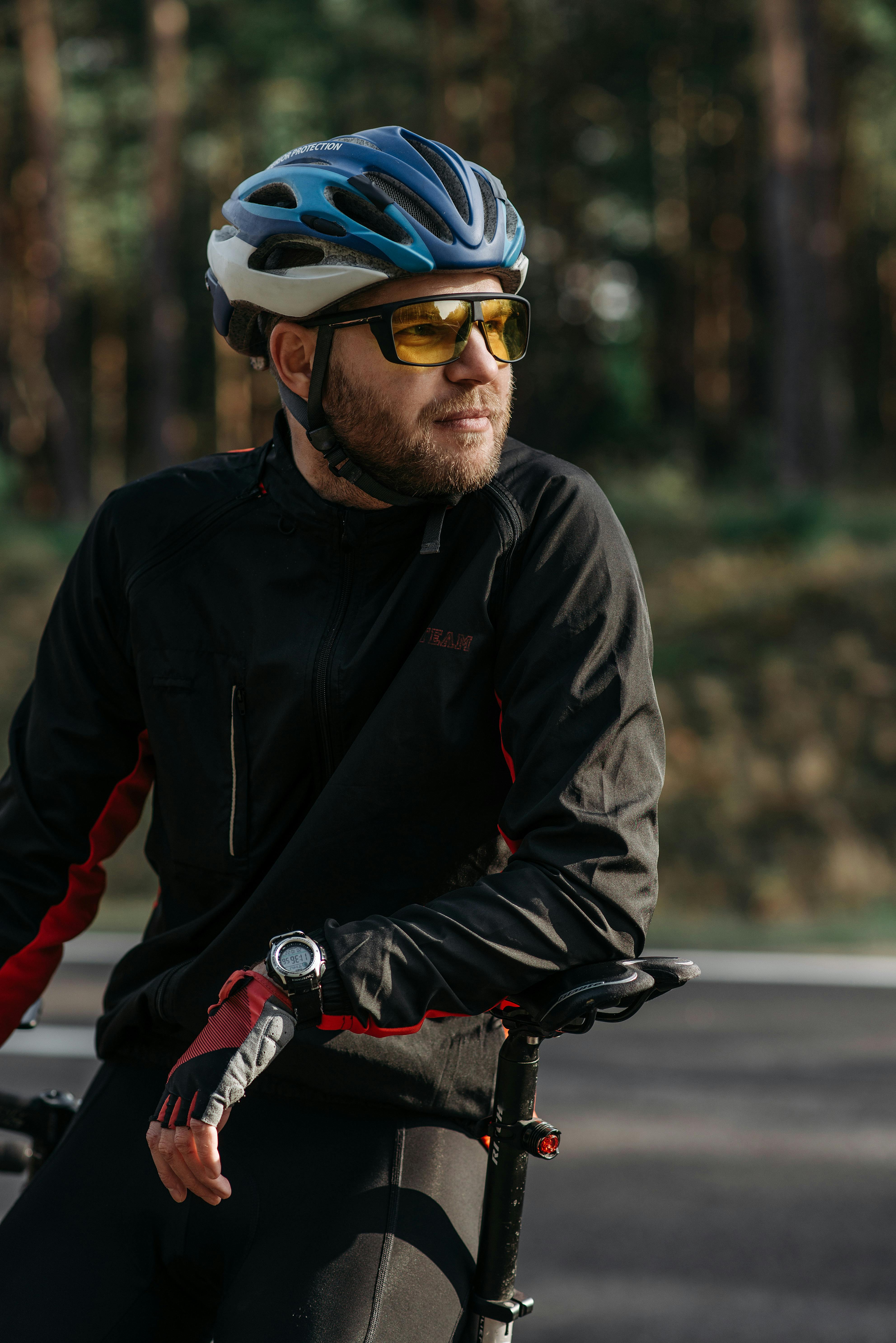 close up photo of biker with helmet on