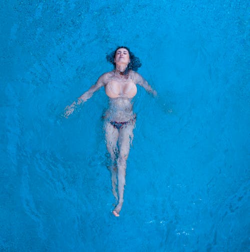 Floating Woman on a Body of Water 