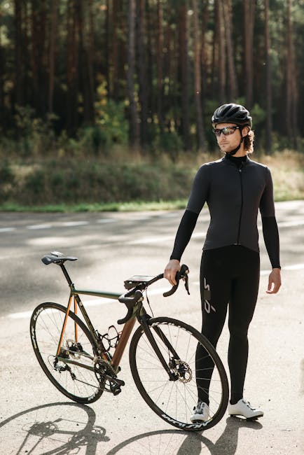 Man with a road bike resting on an outdoor trail. Perfect for cycling themes.