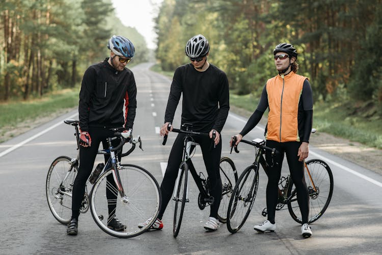 Men Riding Bicycles On The Road