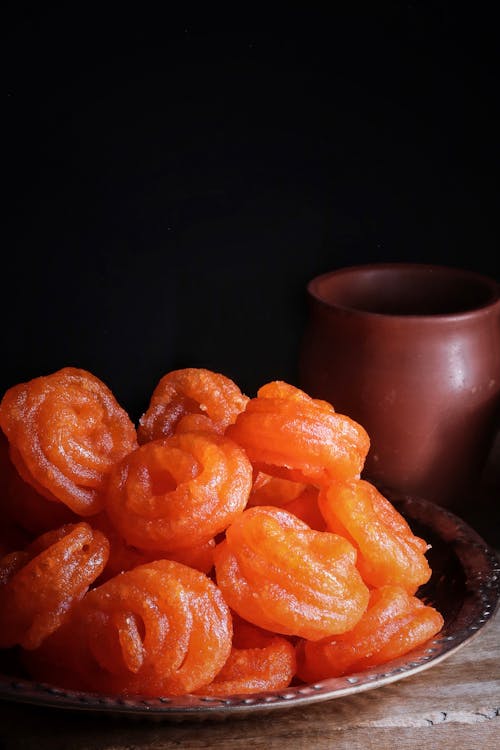 Orange Fruits on Black Ceramic Bowl