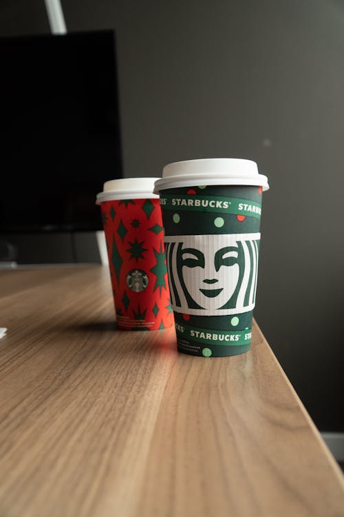 Creative cups for takeaway coffee on table
