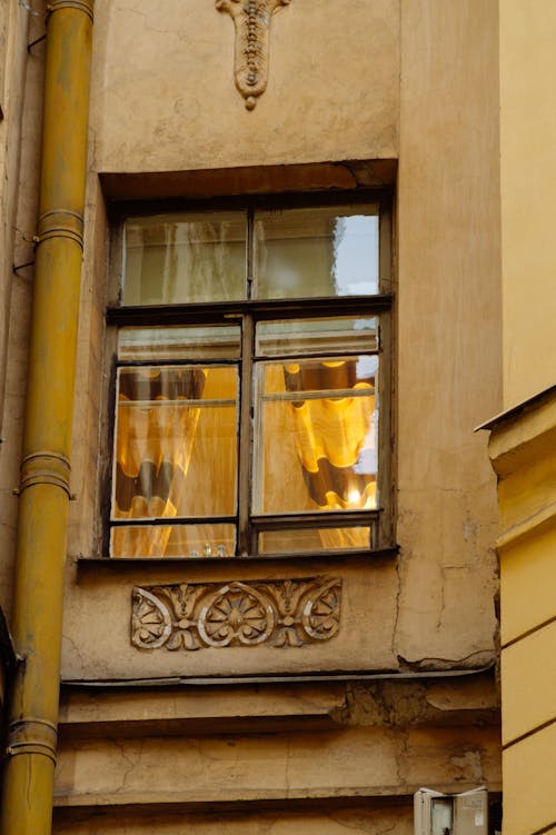 Facade details of old residential building with ornamental details