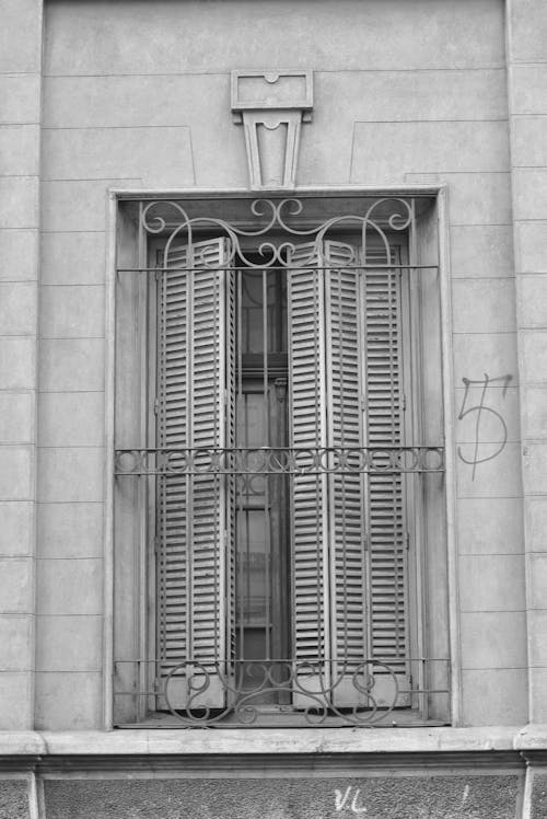 Free A Window Protected by Metal Grills Stock Photo
