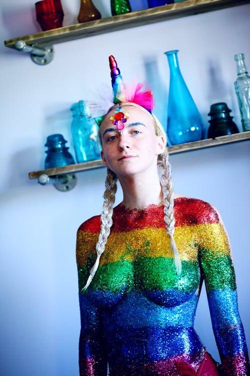 A Woman Body Painted in Rainbow Colors