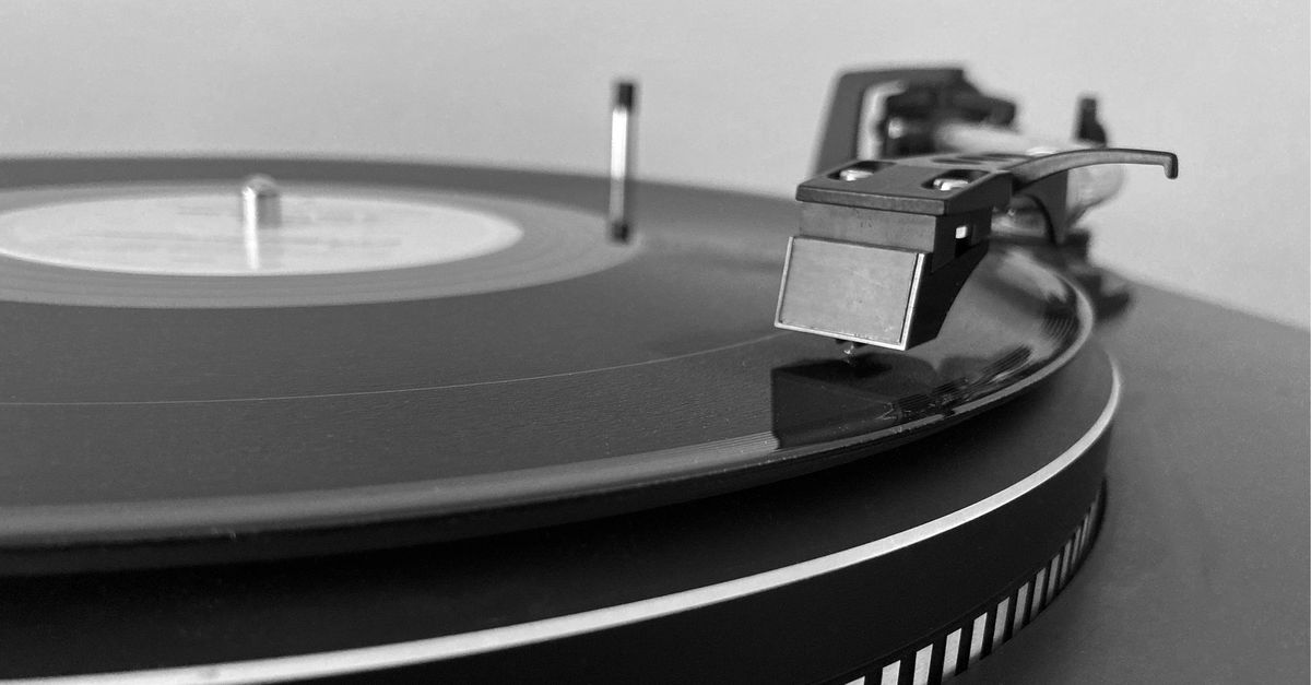 Smartphone filming a record spinning on a turntable for social media