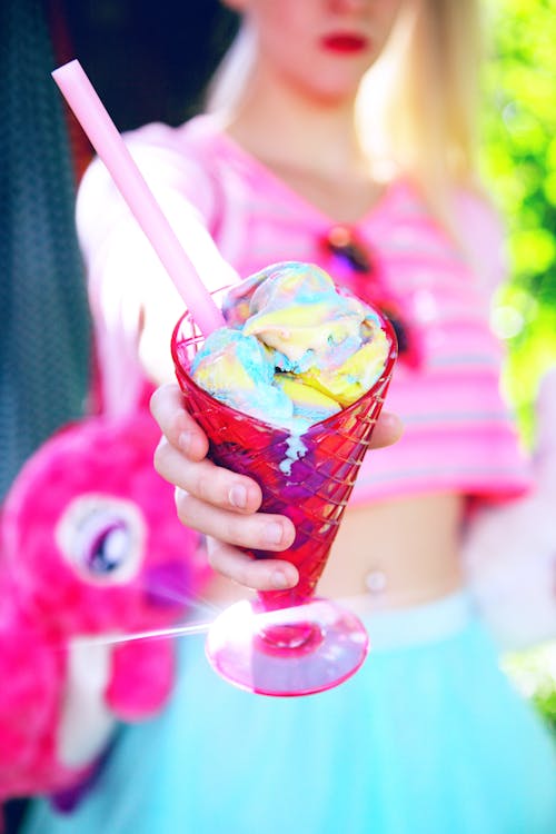 A Person Holding an Ice Cream in a Clear Plastic Cup