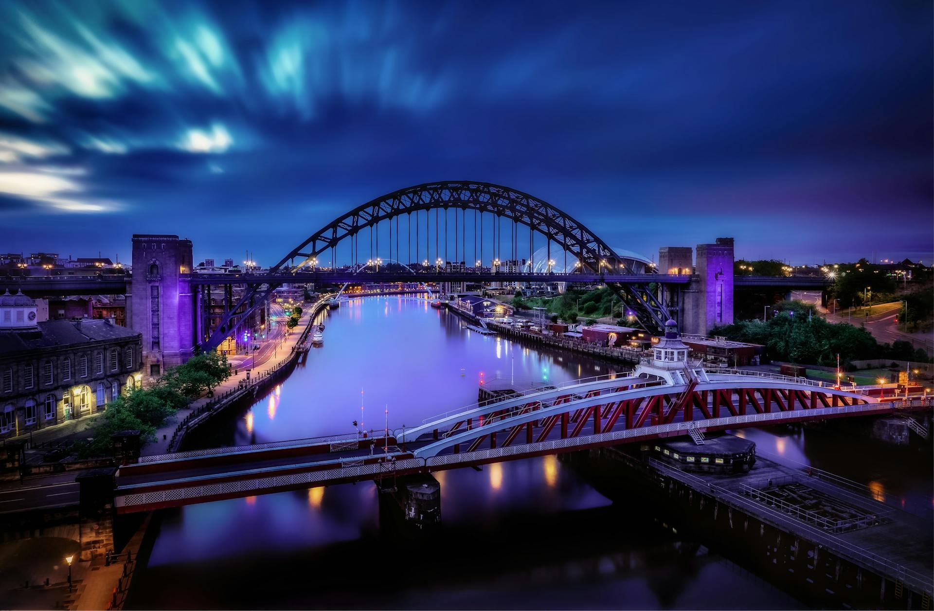 Stunning night view of the Tyne Bridge and River Tyne in the United Kingdom.