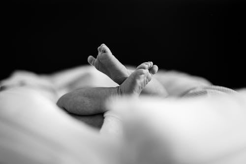 Grayscale Photo of a Baby's Feet 