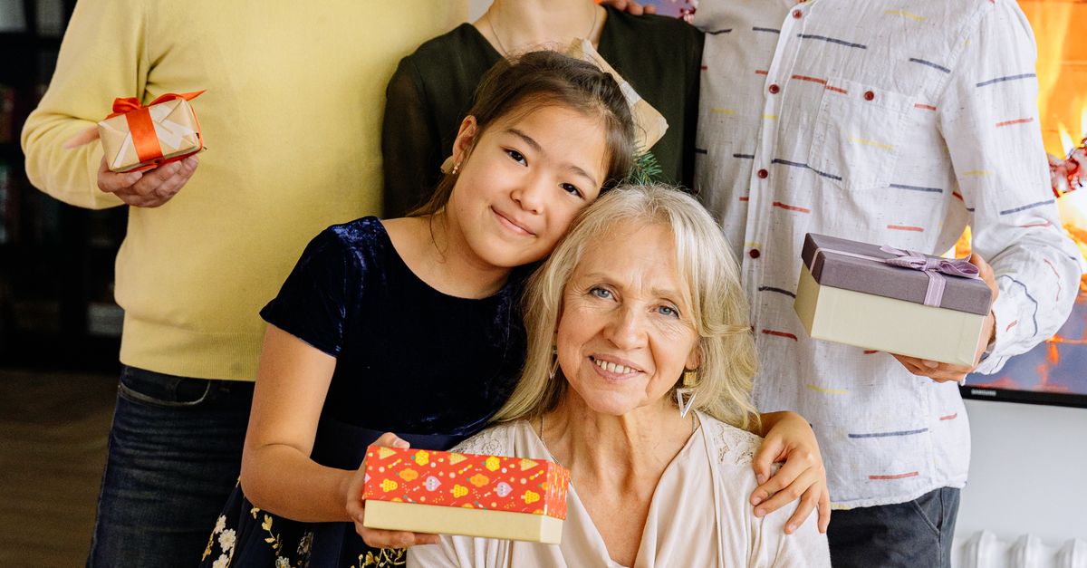 A Family Celebrating an Event with Food and Gifts · Free Stock Photo