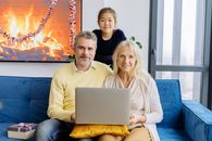 Man in White Long Sleeve Shirt Sitting Beside Woman in Blue Long Sleeve Shirt