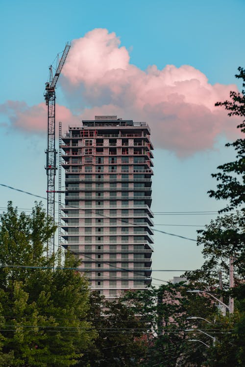 Black High Rise Building Under Cloudy Sky