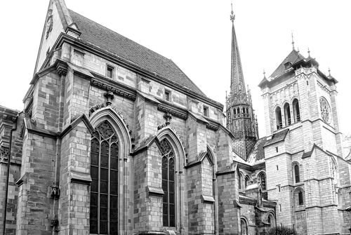 Free Monochrome photograph showcasing the intricate gothic architecture of a historic cathedral. Stock Photo