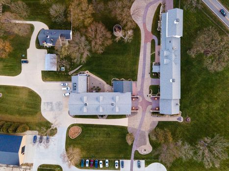 Aerial view of a residential neighborhood with pathways and parked cars in Rochester, Minnesota.