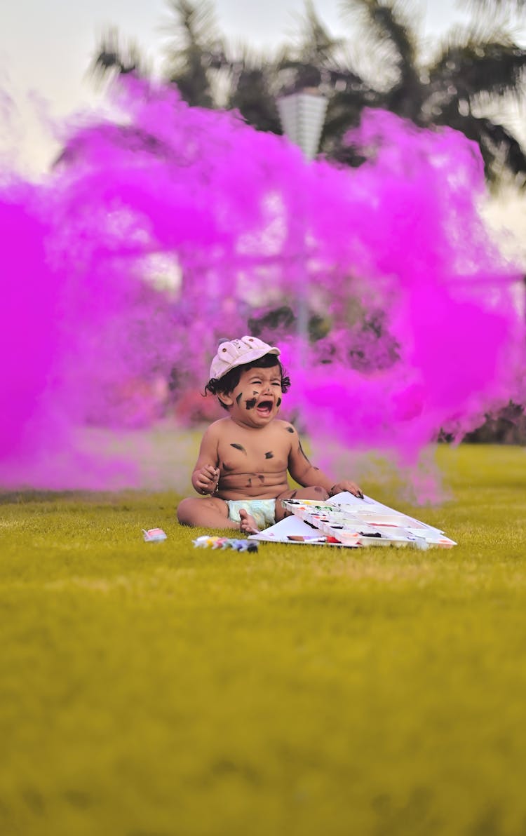 Crying Toddler Sitting On The Ground 