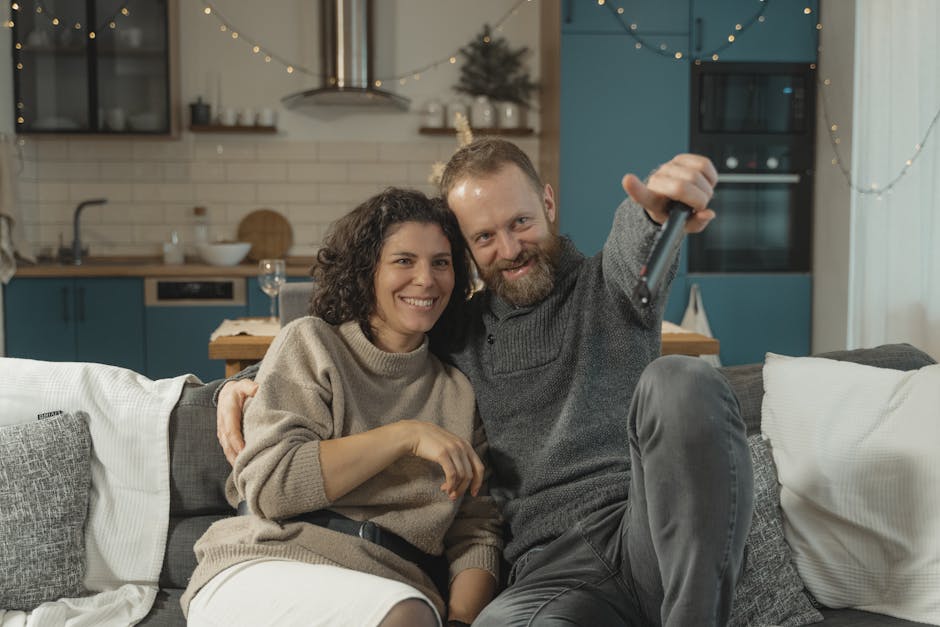 Couple watching Couples Therapy on TV at home - Couples Therapy Couple watching Couples Therapy on TV at home - Couples Therapy
