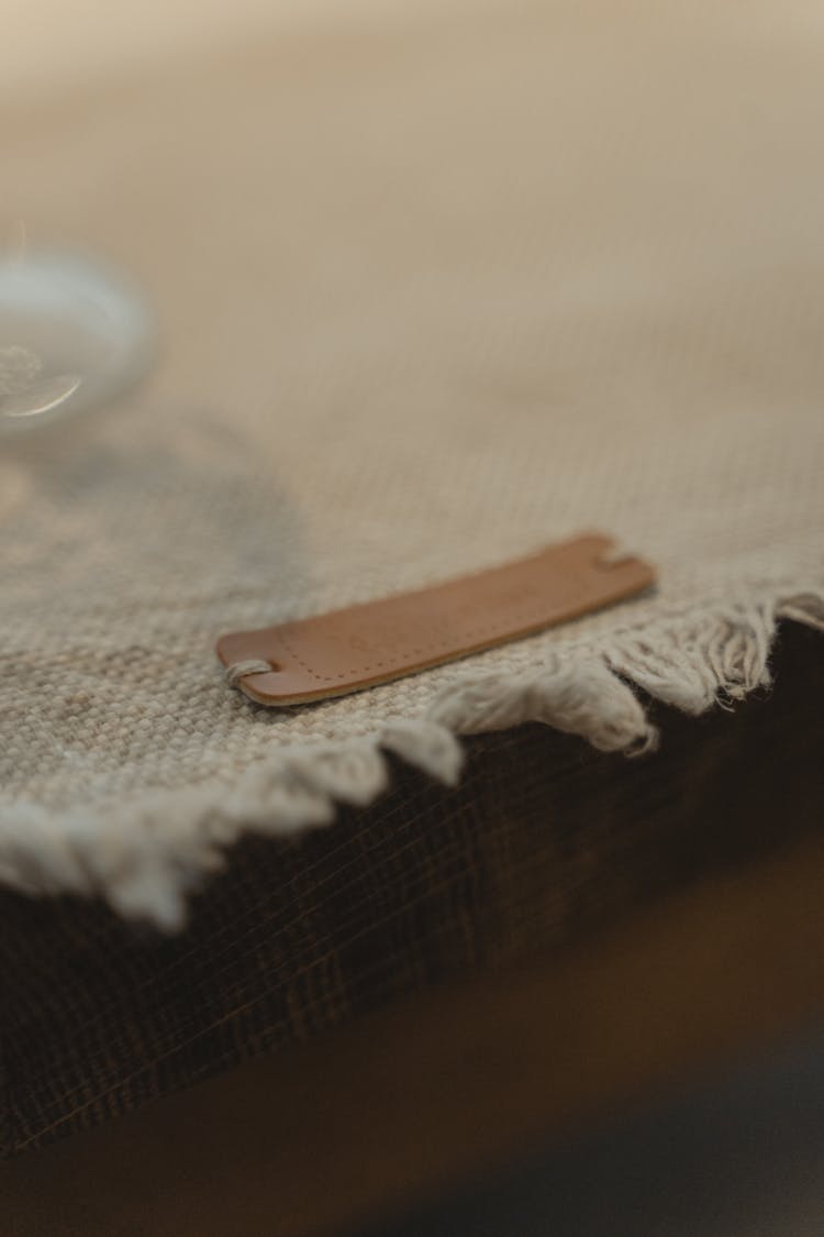 A Leather Tag Sewn In Fabric