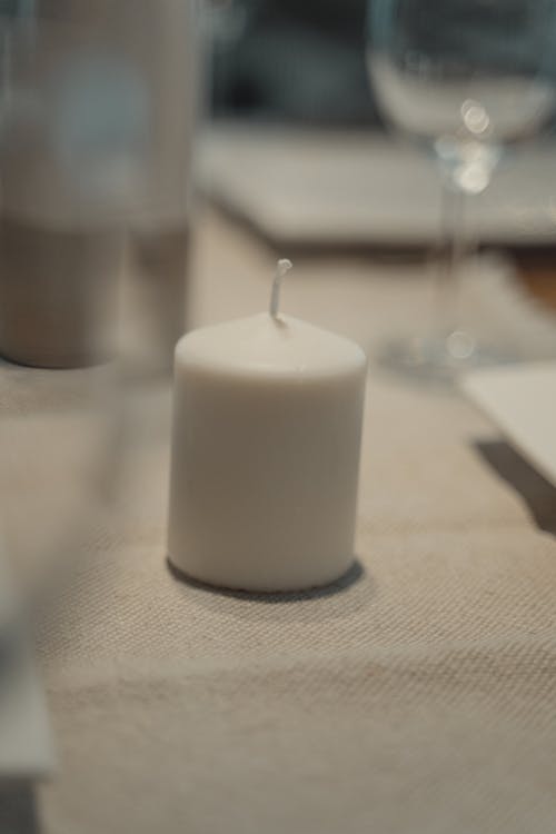 White Candle on White Table Cloth