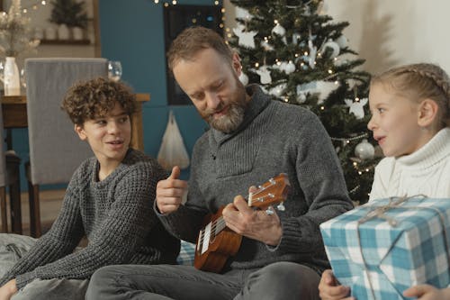 A Father Playing Ukulele for the Kids