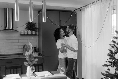 Free A Happily Married Couple Dancing at Home Stock Photo