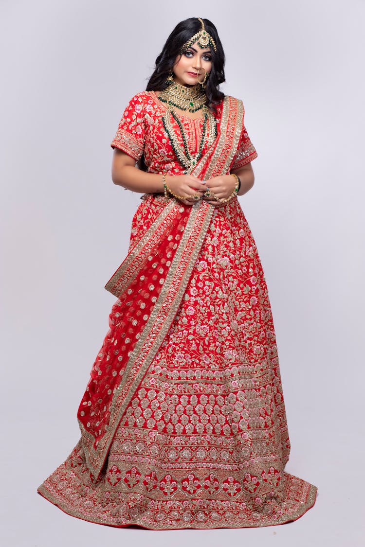 Ethnic Woman In Traditional Indian Outfit In Studio