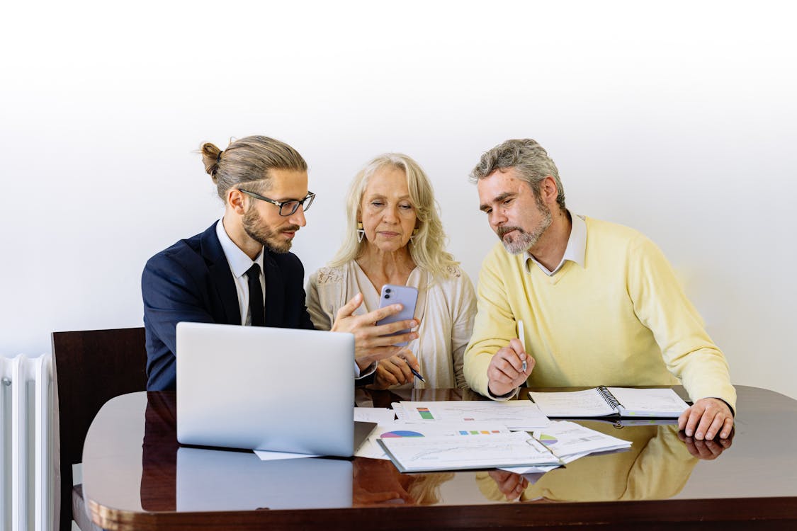 Free Man and Woman Sitting at the Table Stock Photo