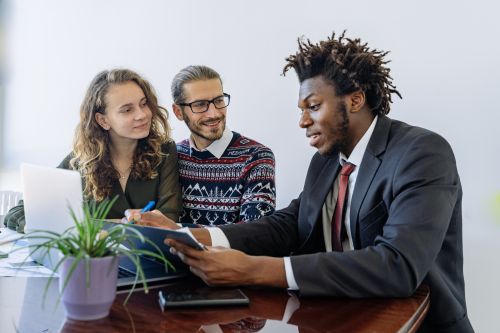 Free A diverse group of professionals collaborating in an office meeting, showcasing teamwork and partnership. Stock Photo