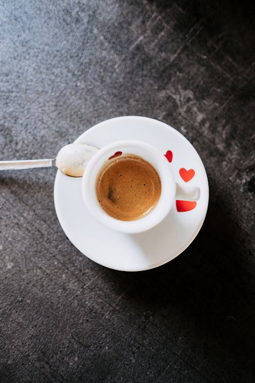 Free Cup of Coffee on a Ceramic Saucer Stock Photo