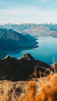 Breathtaking mountain landscape with a tranquil lake under a clear sky.