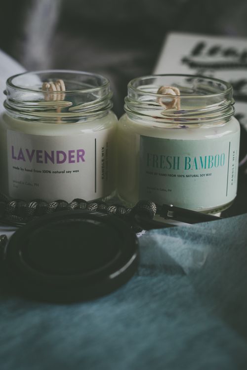 Free Capture the soothing essence of lavender and fresh bamboo scented candles in glass jars. Stock Photo