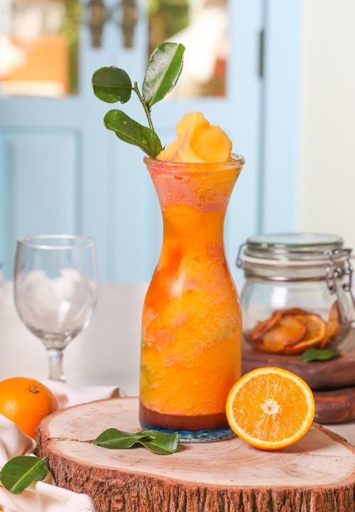 Orange Juice on Clear Glass Container