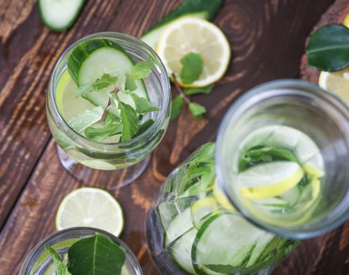 Free Top view of lemon cucumber water with mint, perfect for detox and hydration. Stock Photo