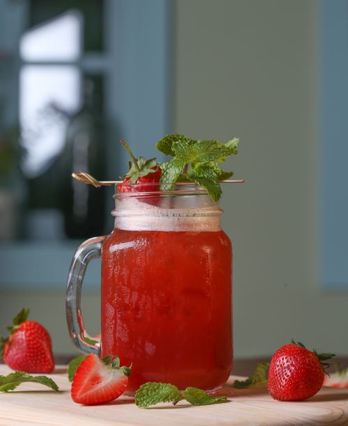 Free A vibrant strawberry mint lemonade served in a mason jar, perfect for any refreshing summer day. Stock Photo